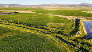 Aerial view of sparsely populated area featuring a water and mountain view