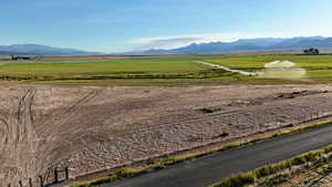 View of mountain background featuring rural landscape