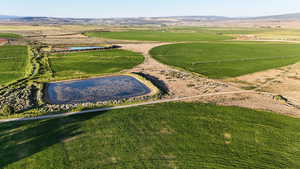 Aerial overview of property's location with rural landscape and a water and mountain view