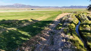 View of mountain background featuring rural landscape