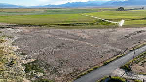 Aerial view of sparsely populated area with a mountain backdrop