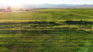 View of mountain backdrop with rural landscape