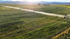 View of mountain backdrop featuring rural landscape