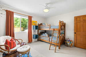 Bedroom featuring carpet flooring and ceiling fan