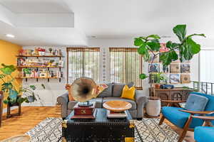 Living area featuring wood finished floors and baseboards