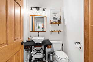 Bathroom featuring a sink and toilet