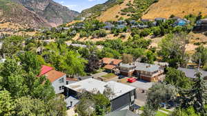 Aerial perspective of suburban area featuring a mountain backdrop