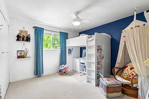 Bedroom with carpet floors and ceiling fan