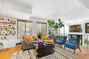 Living room with light wood finished floors and baseboards