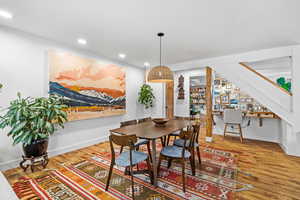 Dining area featuring wood finished floors and recessed lighting