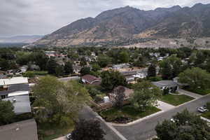 View of aerial perspective of the property with  mountain background & nearby suburban area