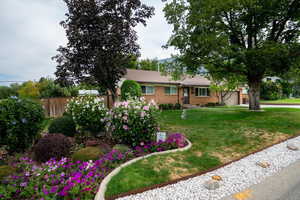Ranch-style home with a garage and brick siding