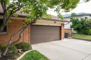 Garage featuring driveway and a mountain view