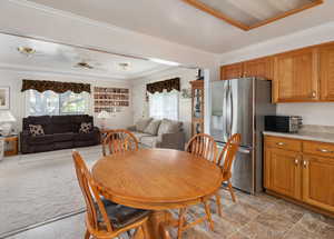 Dining area featuring crown molding.