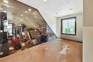 Bonus room featuring recessed lighting and a textured ceiling