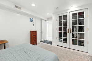 Bedroom with recessed lighting and french doors