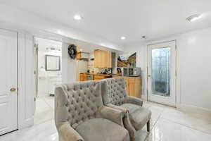 Living room with recessed lighting and baseboards