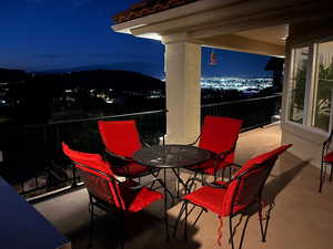 Patio at night featuring a patio area