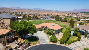 Aerial perspective of suburban area with a mountainous background