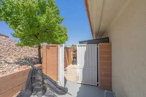 View of patio featuring a gate