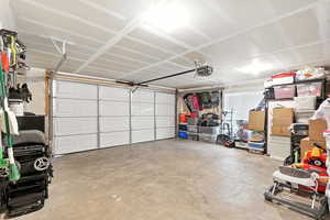 Garage featuring a garage door opener