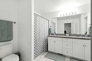 Bathroom featuring double vanity
