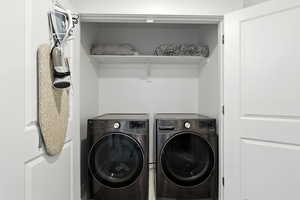 Washroom featuring washing machine and clothes dryer