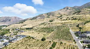 Aerial view of property and surrounding area with mountains and rural landscape