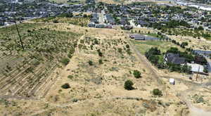 Aerial overview of property's location featuring rural landscape and nearby suburban area