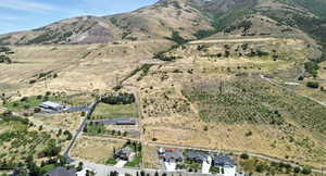 Aerial view of property's location featuring rural landscape and mountains
