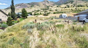 View of mountain background featuring rural landscape