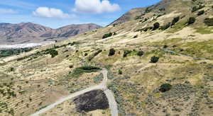 View of mountain backdrop with rural landscape