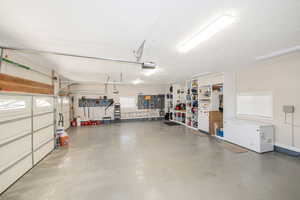 Garage with insulated door and built-in storage.