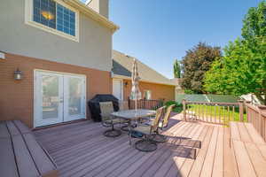 Trex deck with outdoor dining area and grill.