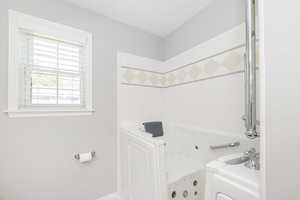 Full bathroom with a walk-in tub