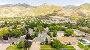 Aerial perspective of suburban area with a mountainous background