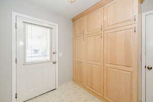 Entryway with tile patterned floors