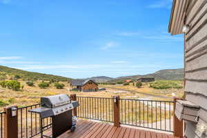 Deck with grilling area and a mountain view