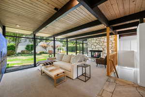 Sunroom with beamed ceiling