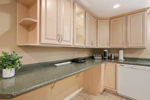 Kitchen featuring light brown cabinets, white dishwasher, light tile patterned floors, open shelves, and recessed lighting