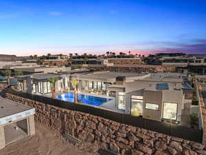 Pool at dusk with a community pool