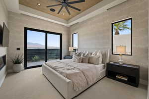 Carpeted bedroom with access to exterior, wooden ceiling, recessed lighting, a tray ceiling, and ceiling fan