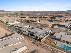 Aerial perspective of suburban area featuring a mountainous background