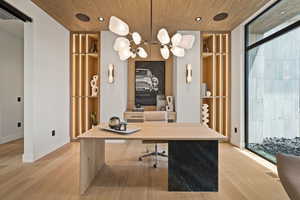 Office featuring light wood-type flooring, expansive windows, recessed lighting, wood ceiling, and a chandelier