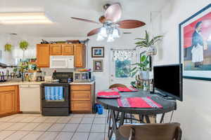 Kitchen with tiled floor and door to backyard