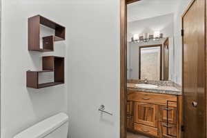 Half bath with vanity and toilet