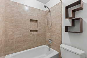 Full bath with shower / washtub combination and toilet