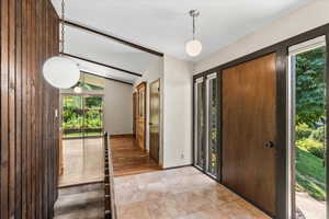 Entryway with plenty of natural light and light tile patterned floors