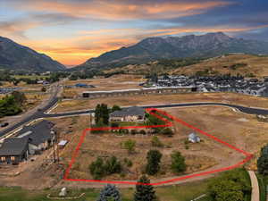 Aerial view at dusk of a mountain view and property boundaries highlighted