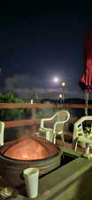 Patio at night with a balcony